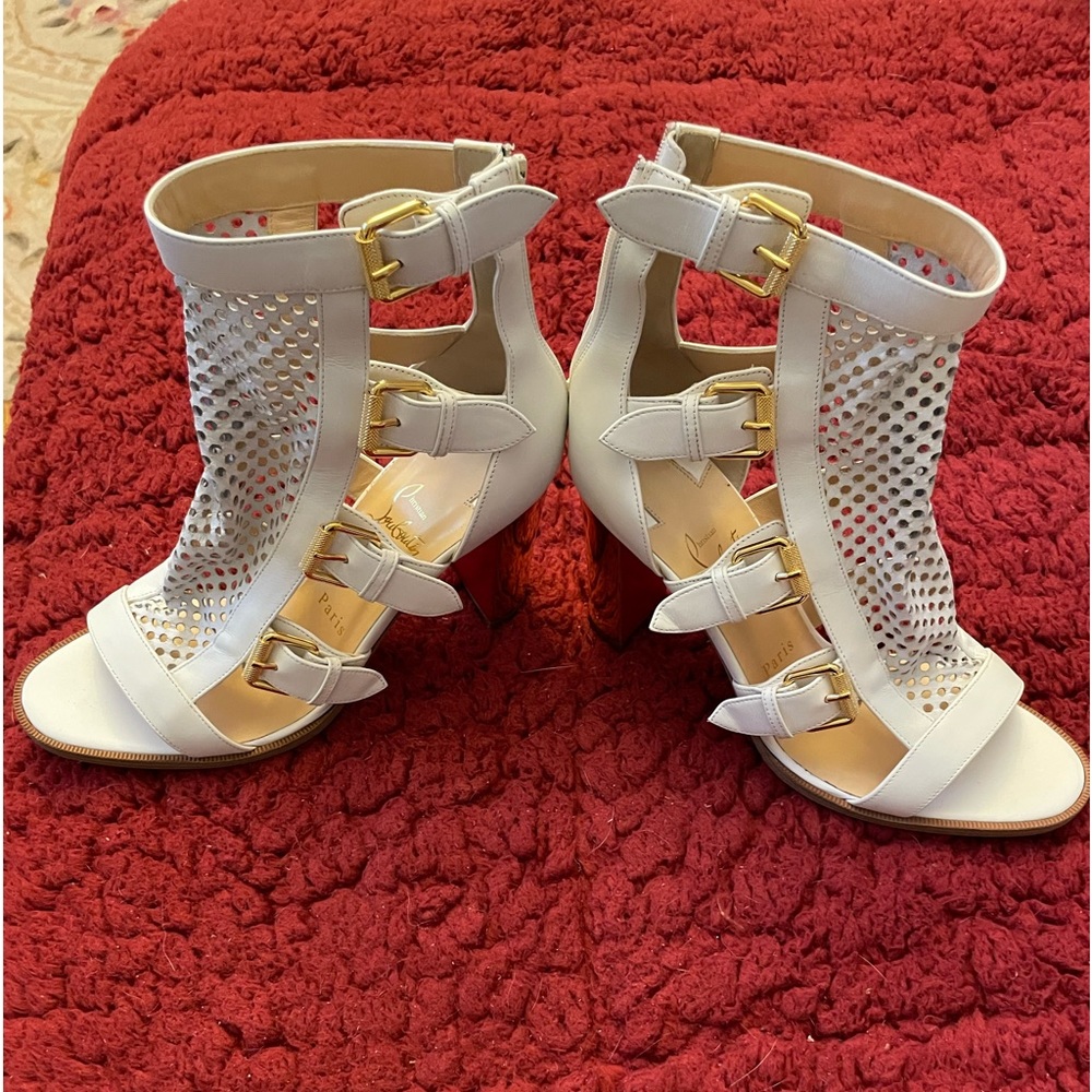 White mesh Christian Louboutin booties with block, 3 1/2” gold heel.